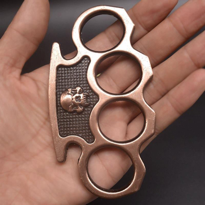 Skull brass knuckle dusters rose gold