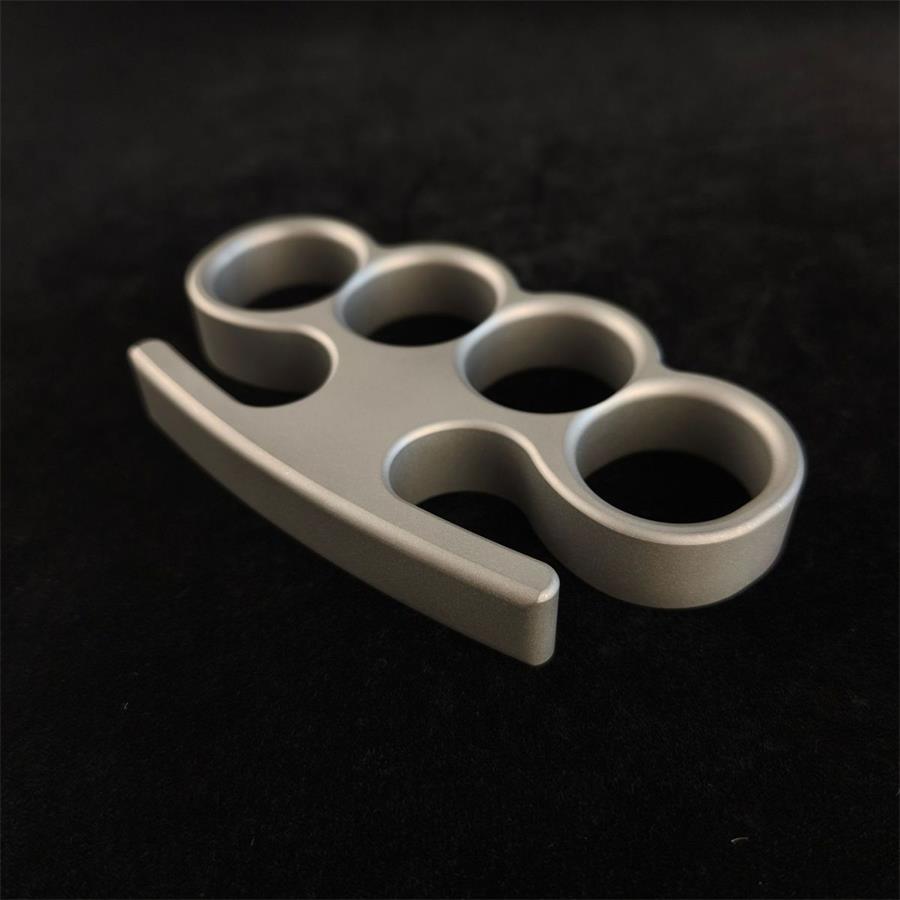 Solid classic TC21 titanium knuckle duster closeup