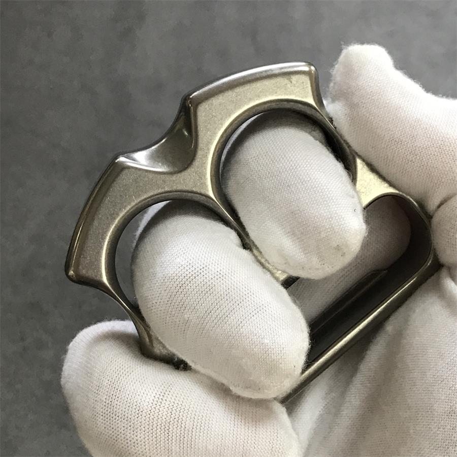 TC21 titanium two finger bottle opener knuckle duster closeup