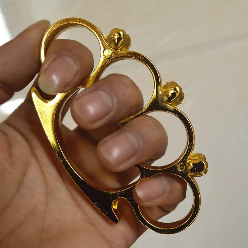 gold little ghost brass knuckle duster