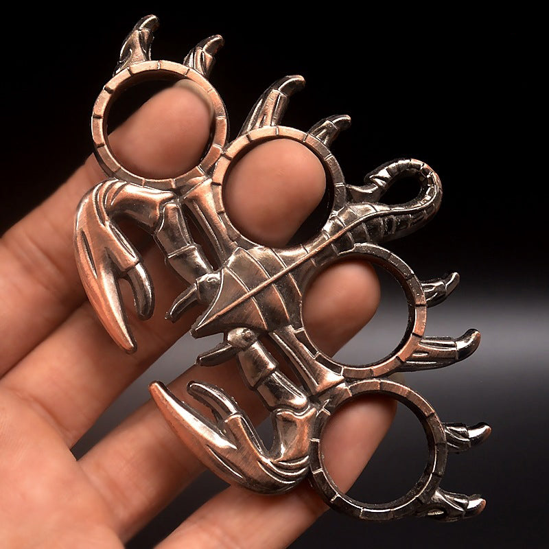 rose gold scorpion knuckle duster